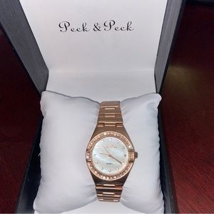 Peck & Peck rose gold tone ladies watch. New in the box.